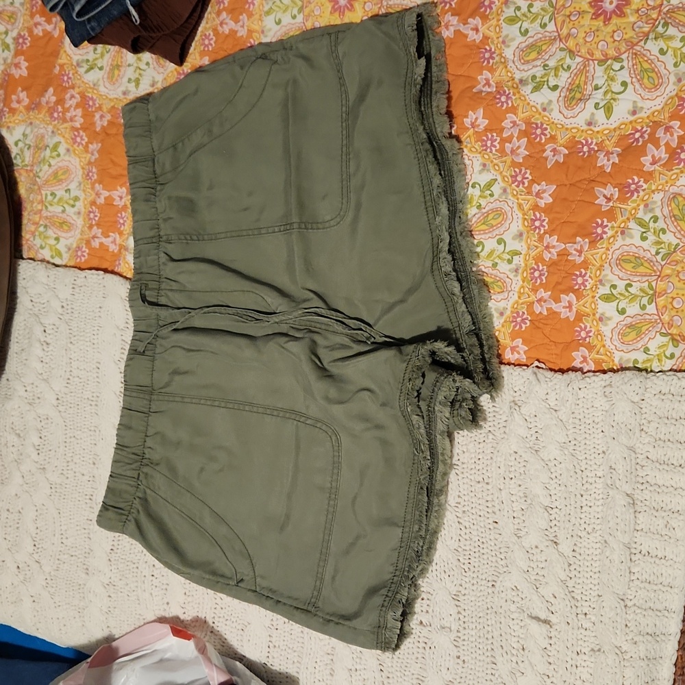 Green frayed shorts